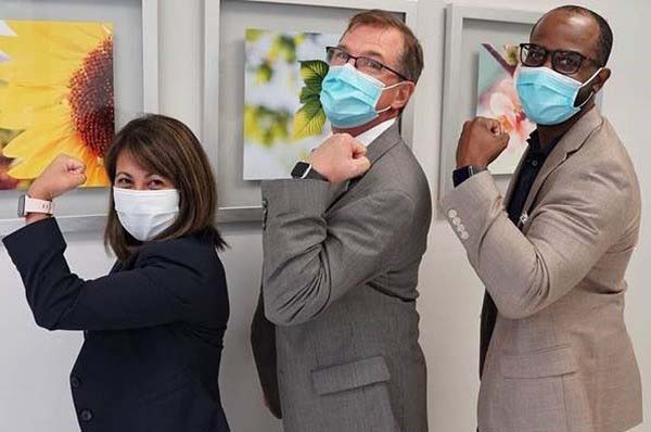 Clinical Operations leaders Jackie Blanchard, Ken Sands and Ryan Sledge pose for a photo after receiving their influenza vaccines.